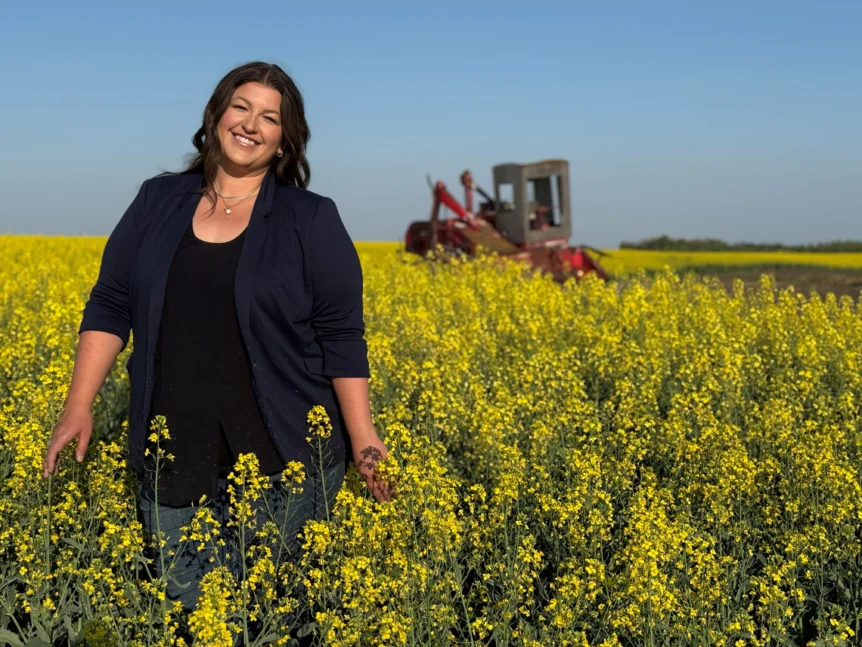 Woman in canola field in Alberta